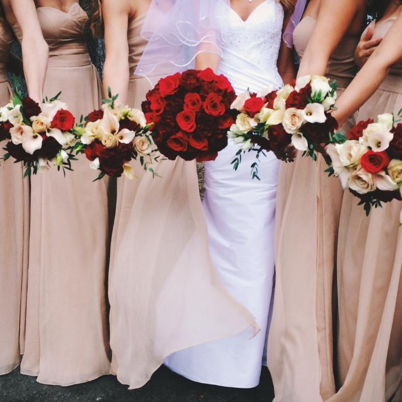bride and her bridesmaid holding bouquets