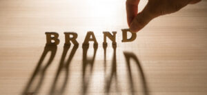 hand holding the name brand