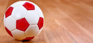picture of a red and white football on a floor