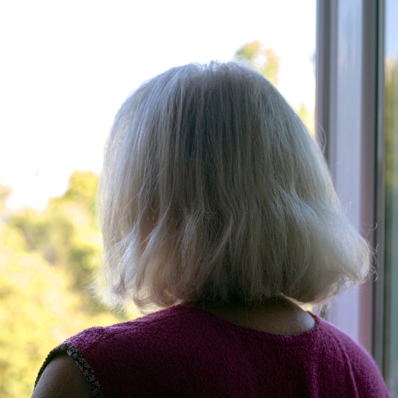 picture of women looking at a window
