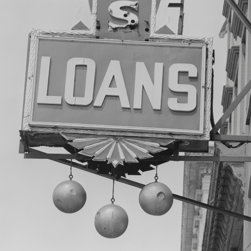 sign saying loans in black and white