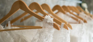 wedding dresses hanging up on a rail