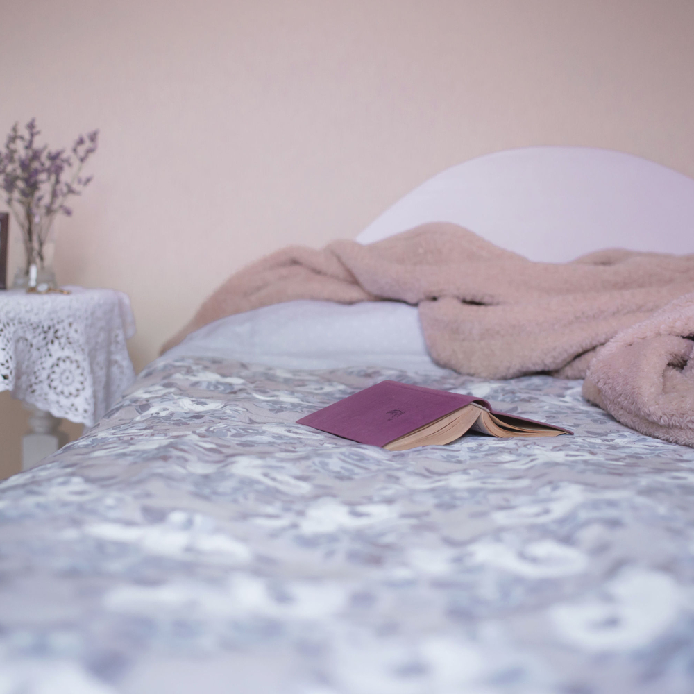 bed with a book on it