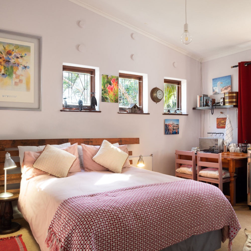 bed with pink throw