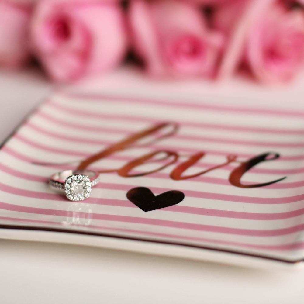 diamond ring sat in a tray saying love