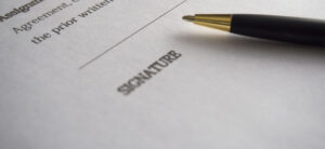 signature and a pen