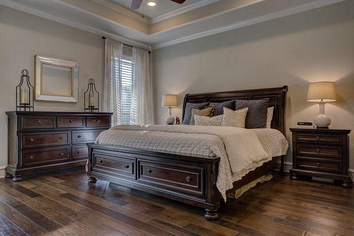 wooden bed in a bedroom
