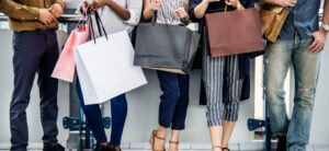 people holding shopping bags