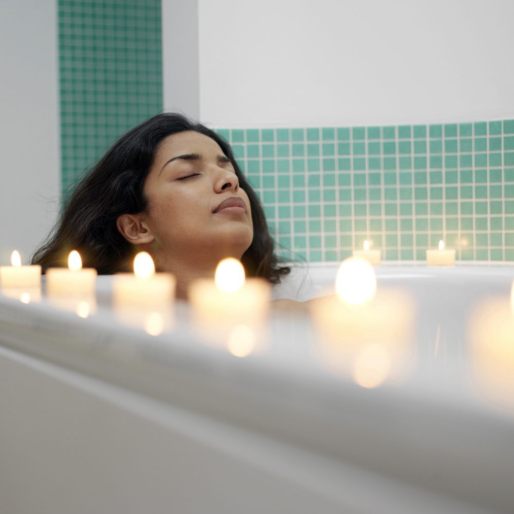 women laying in bath