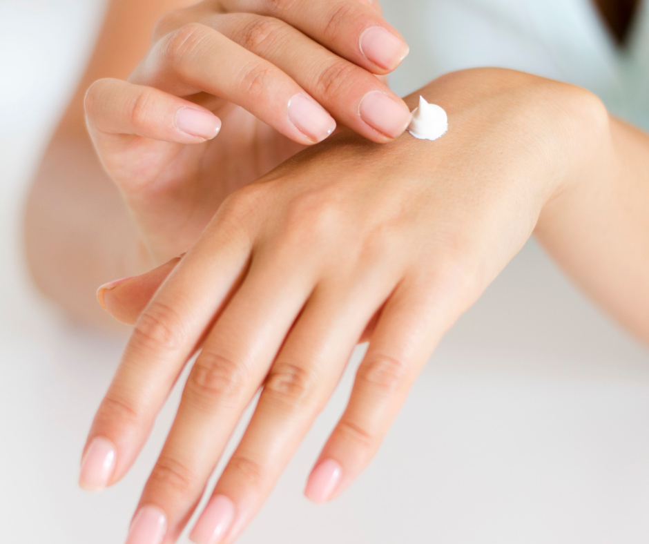 lady rubbing cream into her hand