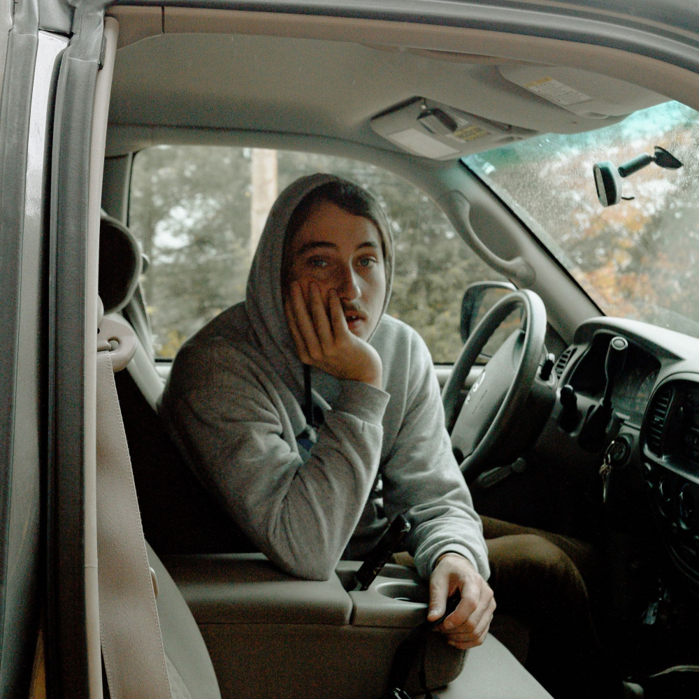 women in broken down care looking sad