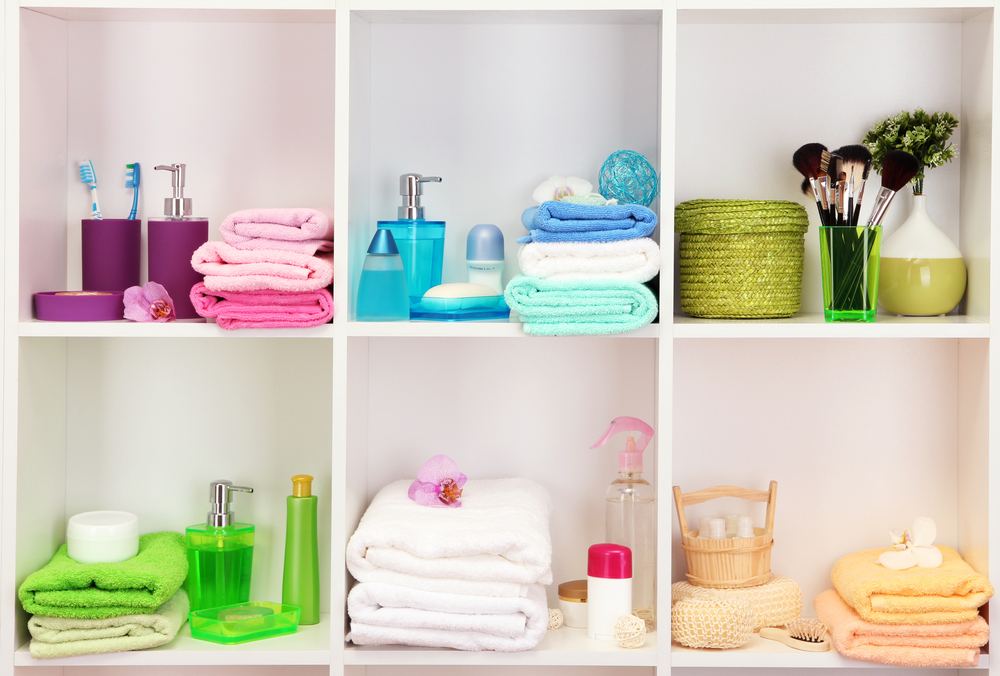 Bath accessories on shelfs in bathroom