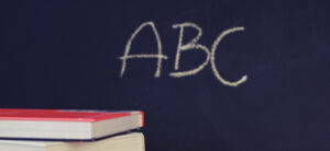 School books and blackboard
