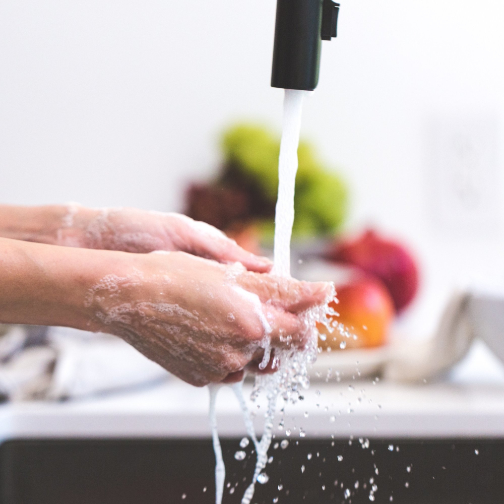 person washing their hands