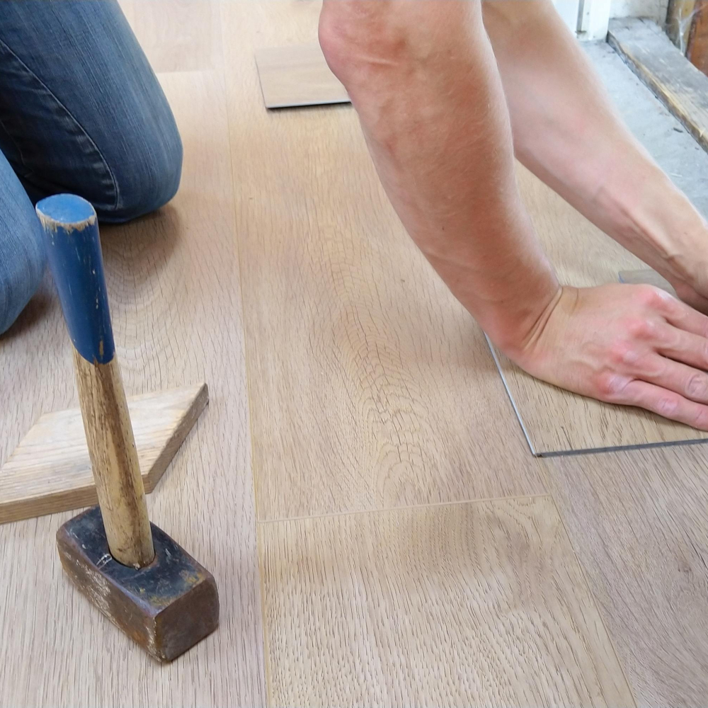 person working on the flooring