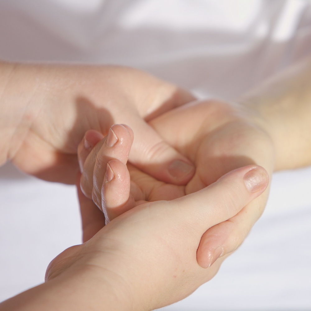 someone giving a hand massage