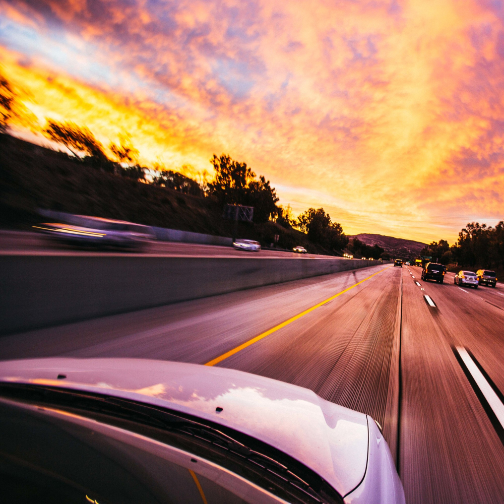 cars driving down a road