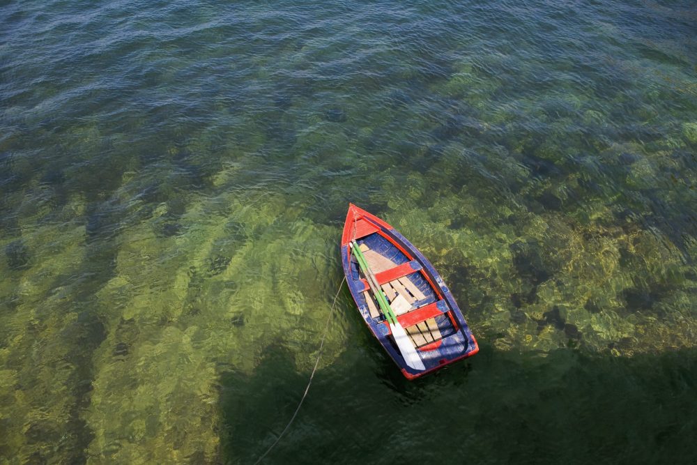 Rowing boat in shallow water asurias spain