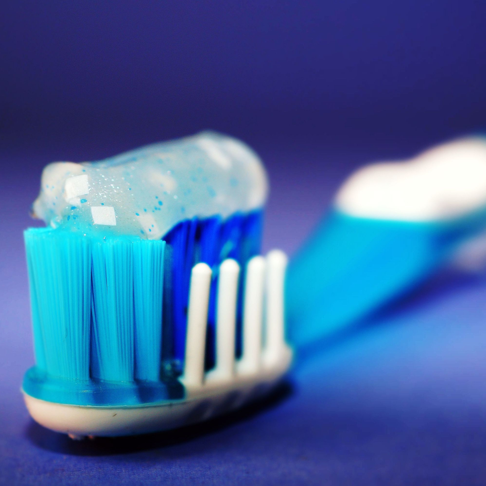 toothbrush with toothpaste on it