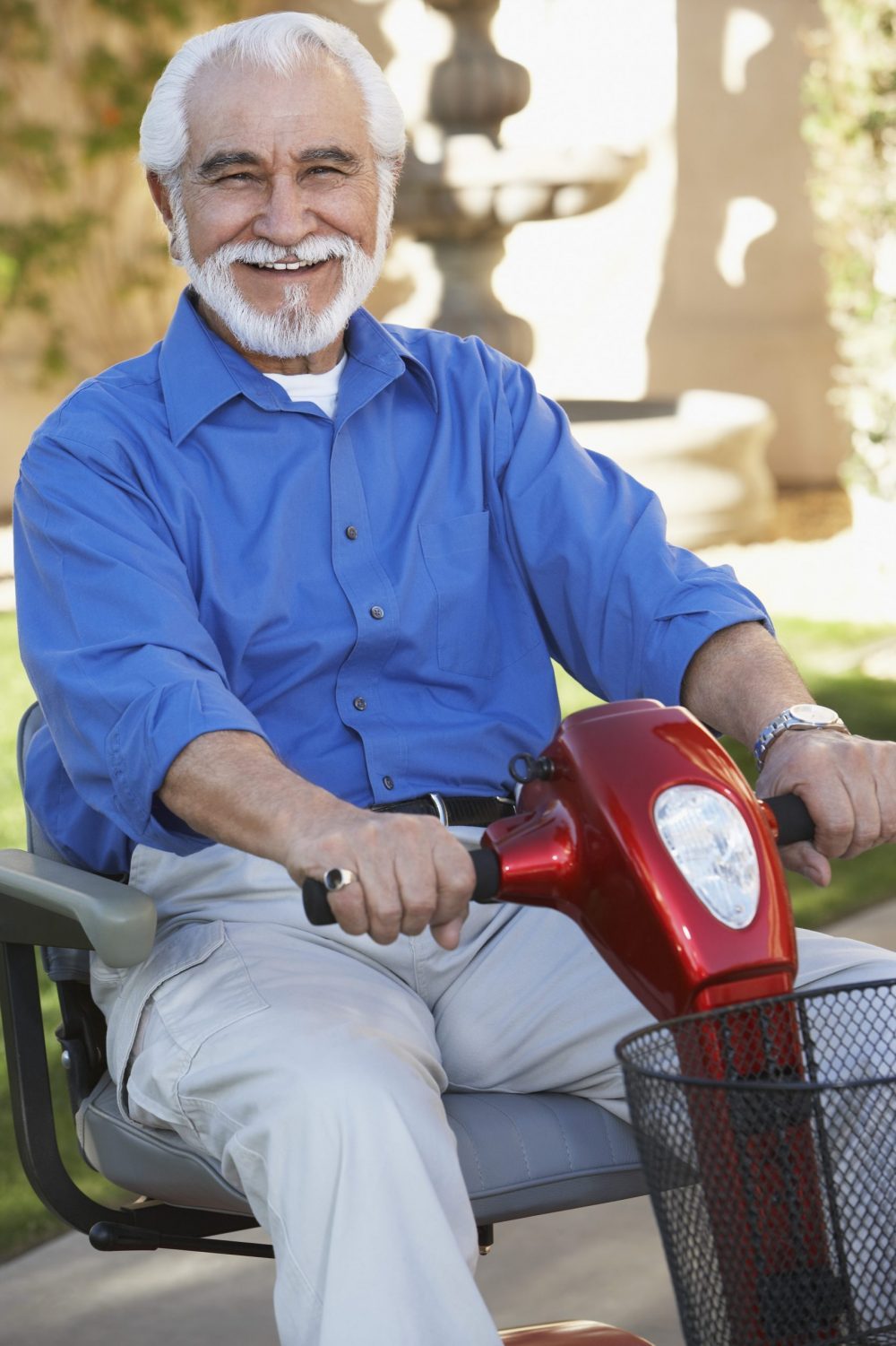 Elderly man on motor scooter