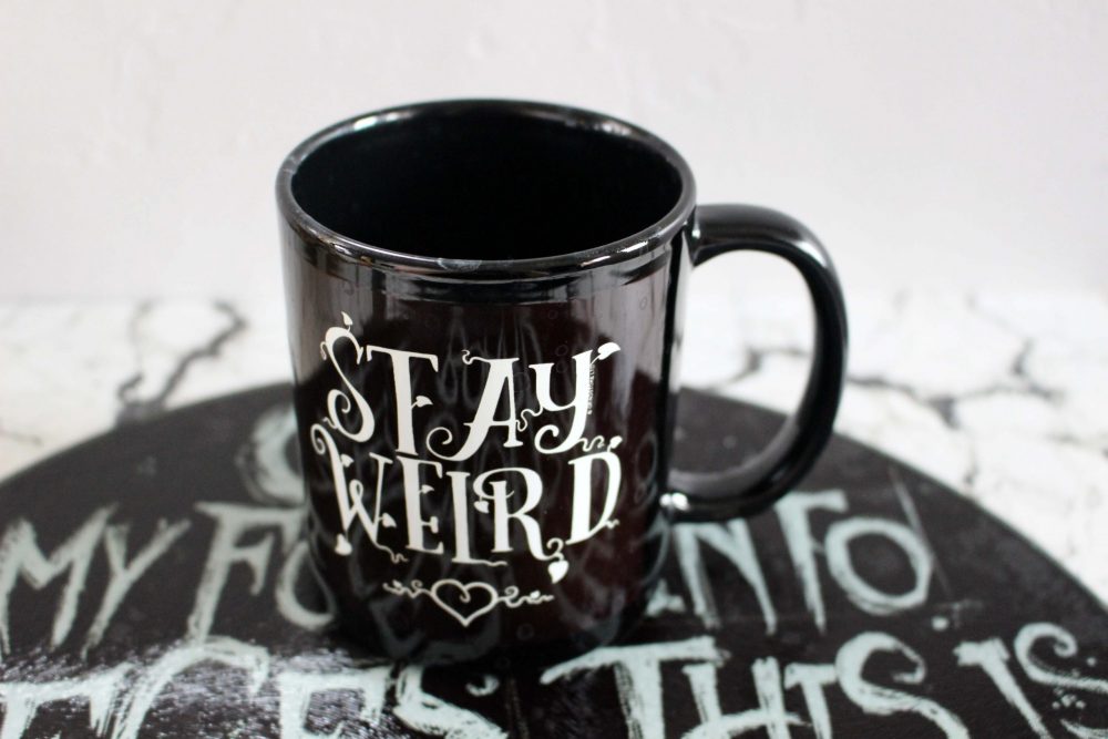 STAY WEIRD BLACK MUG