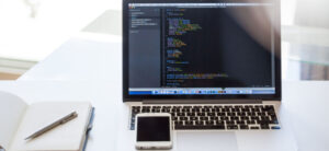 Laptop with coding on screen