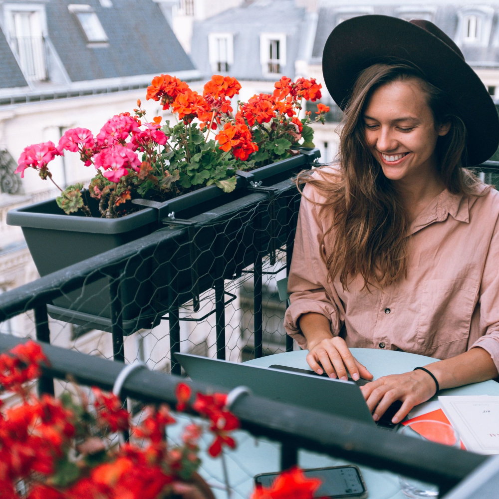 lady working at her laptop while away