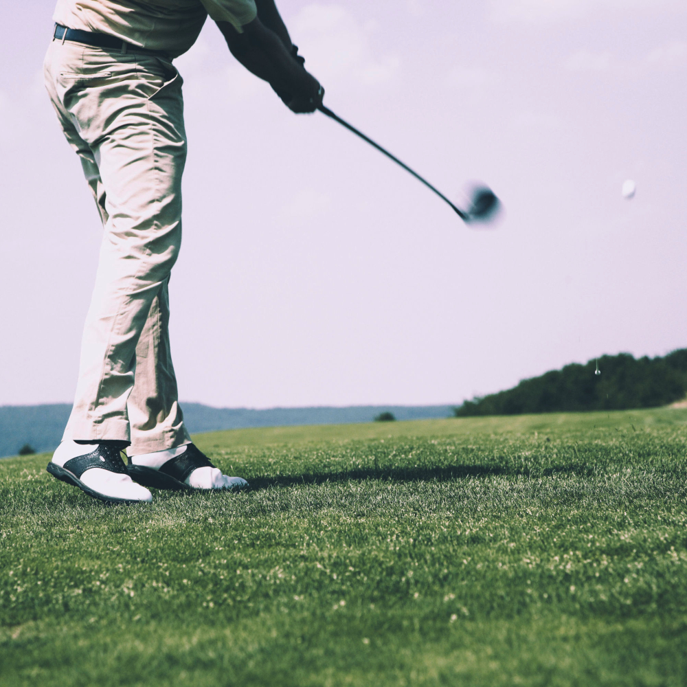 person golfing