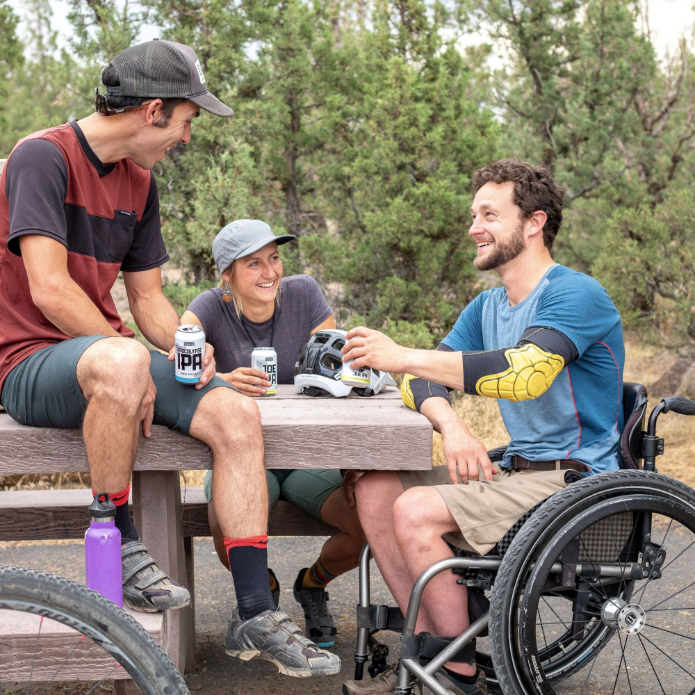 person in a wheelchair enjoying time with friends