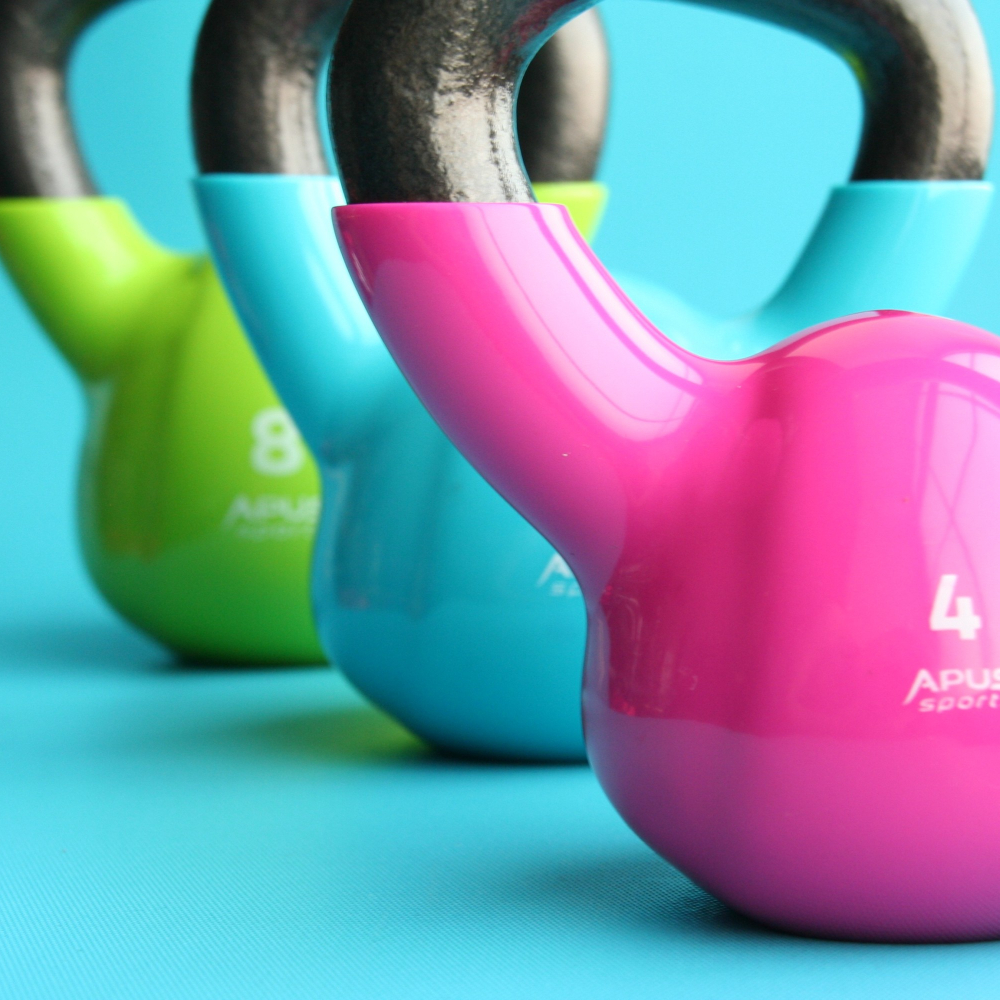 set of colourful weights on blue backdrop