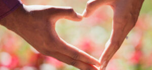 two hands making a heart