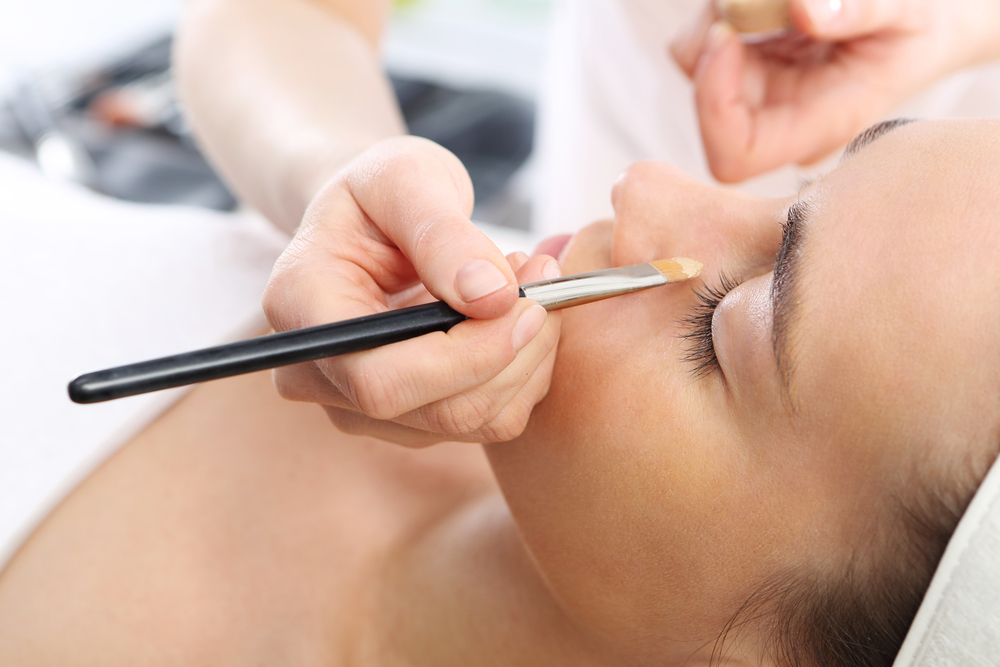 women having makeup applied