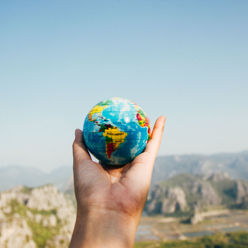 hold holding up a globe