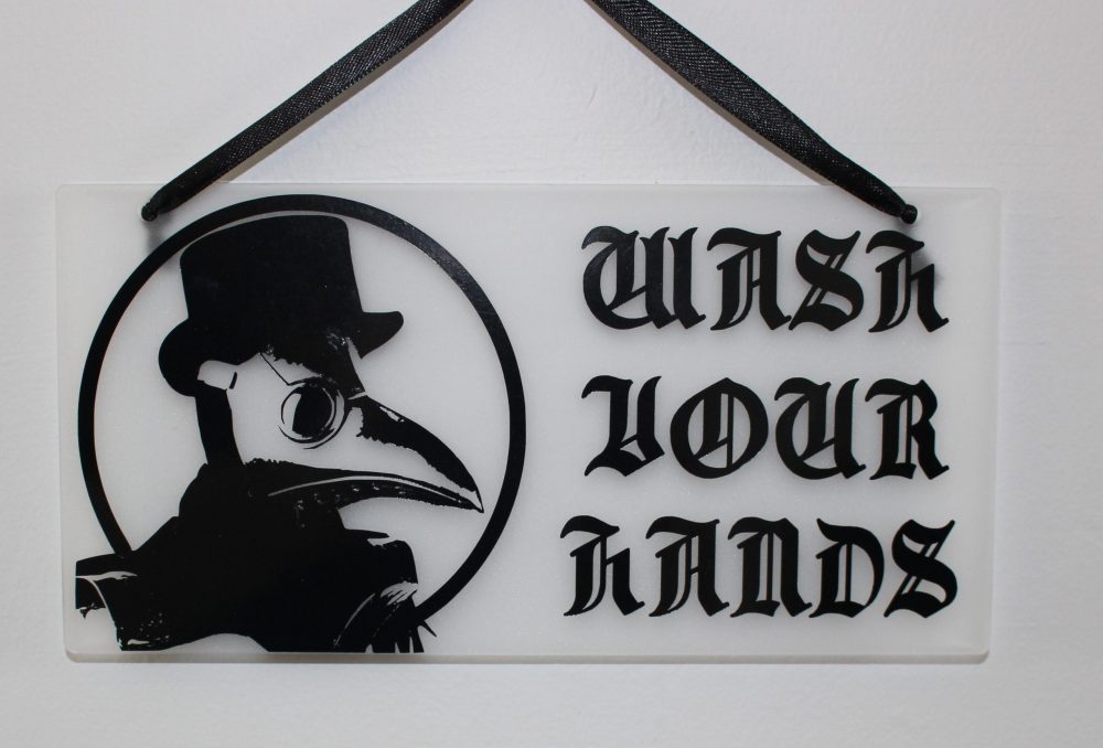 Wash Your Hands Sign Featuring a Plague Doctor
