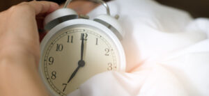 clock wrapped up in blankets