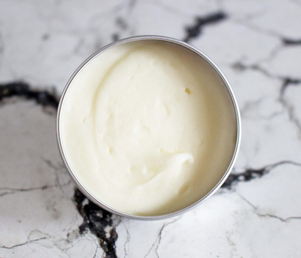 Over head shot of the natural deodarant pot open and cream on show