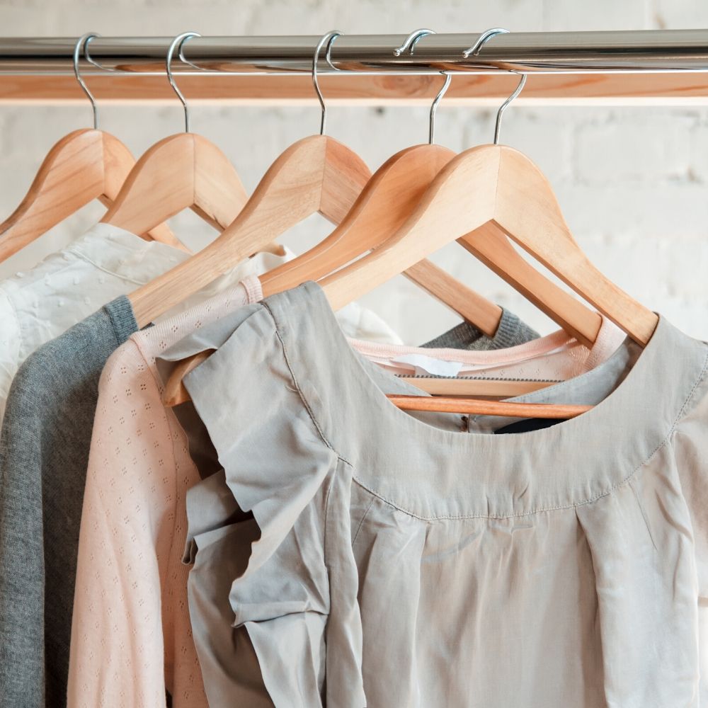 clothing hanging up on hangers