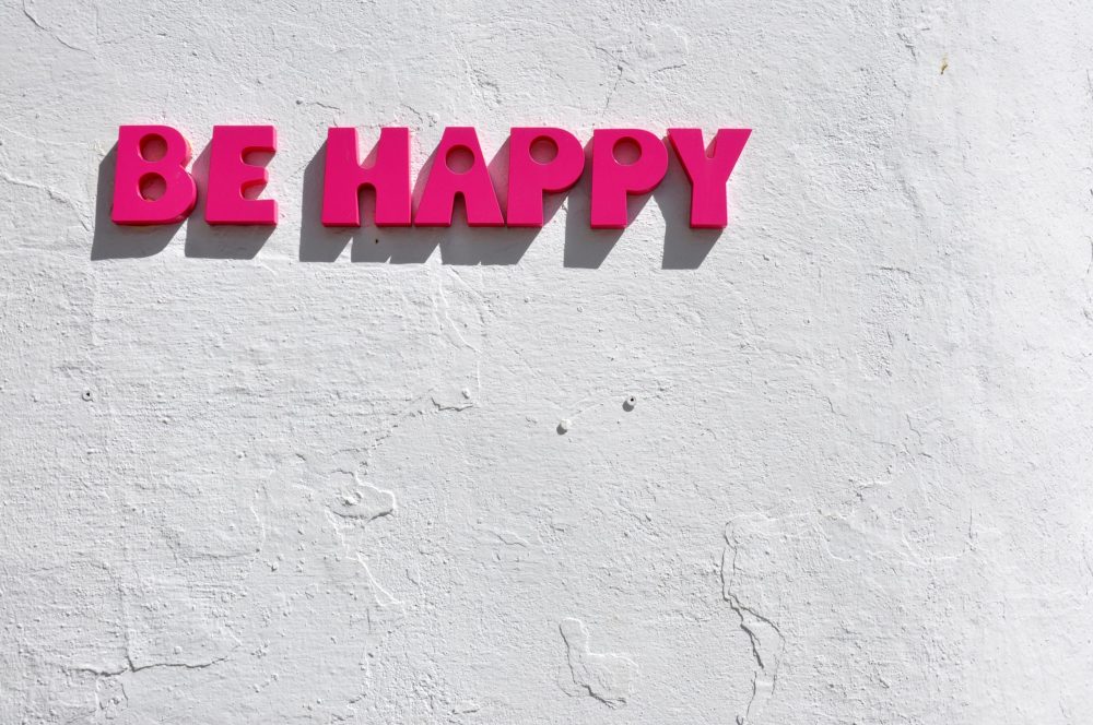 Be Happy in Pink on White Background