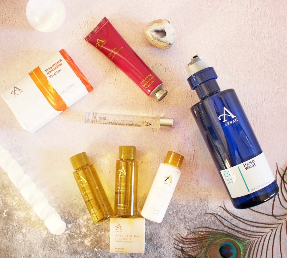 Arran Sense of Scotland collection of items in a flatlay format including after the rain discovery set open, handwash, soap and hand cream