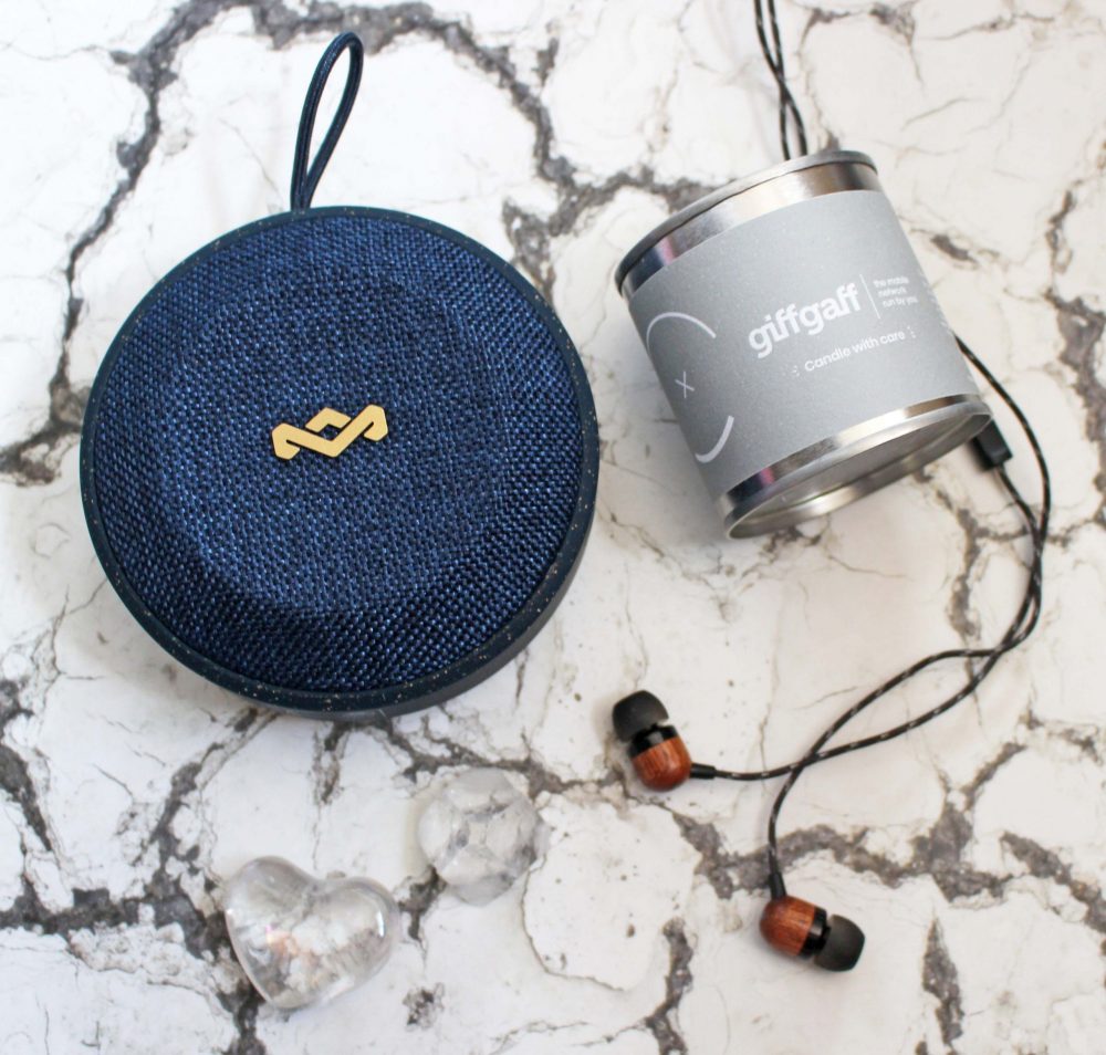 portable bluetooth speaker, headphones and candle