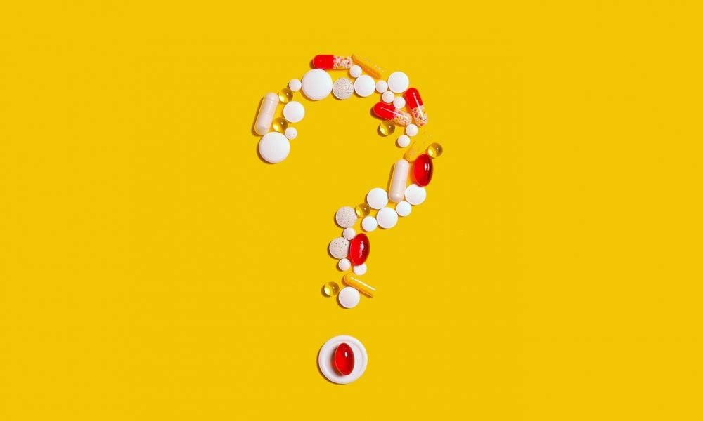 vitamins shaped into a question mark