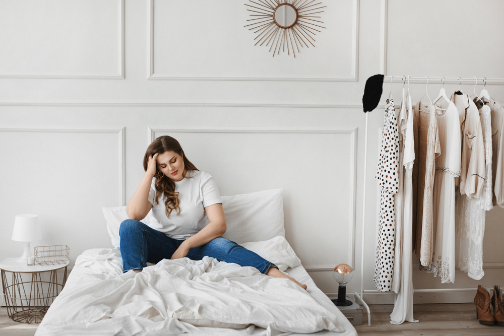women sat on bed chilling out
