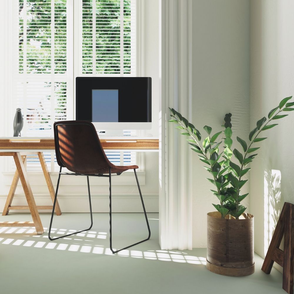 home office set up with computer chair and plant
