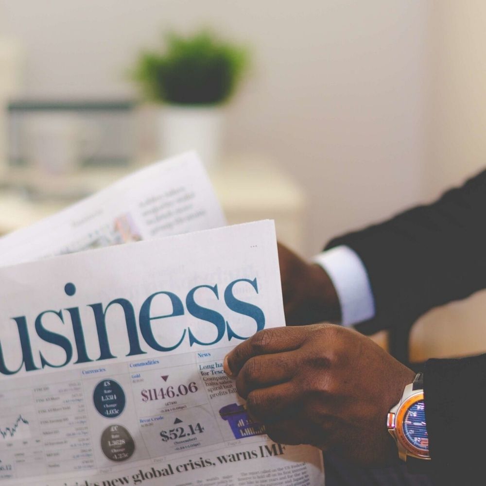 someone reading a business paper