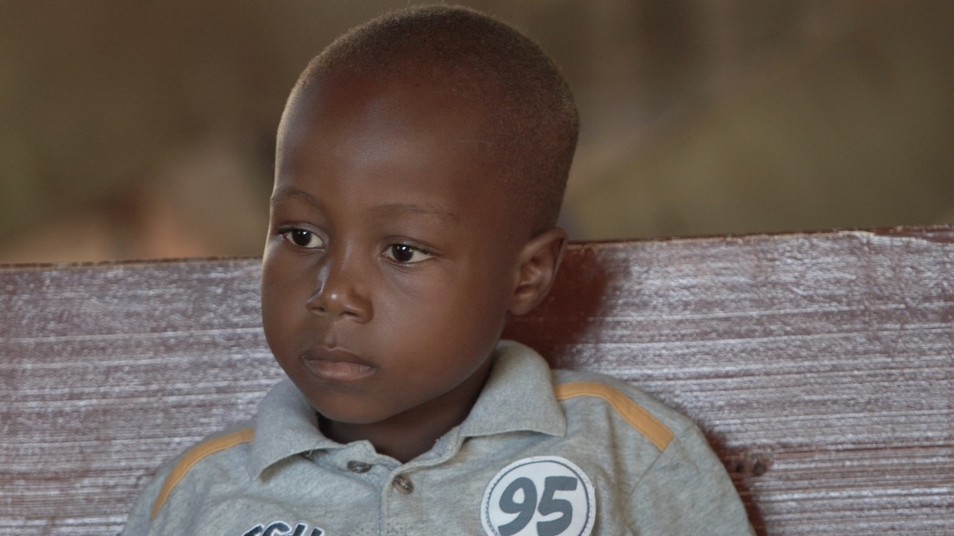 child wearing top with number 95 on it
