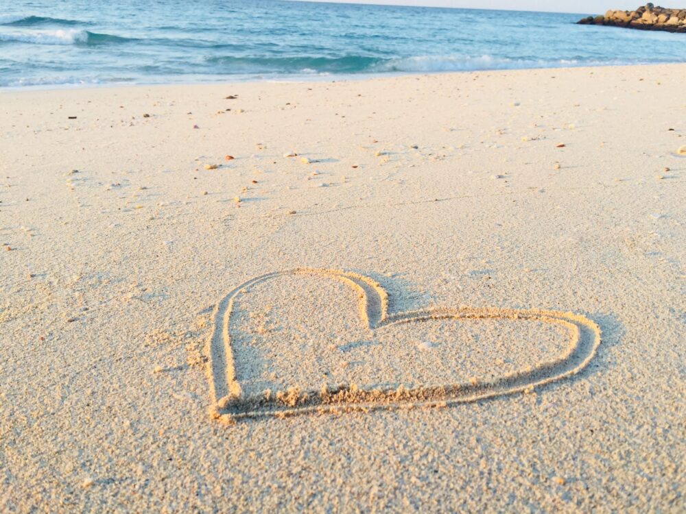 heart drawn in the sand