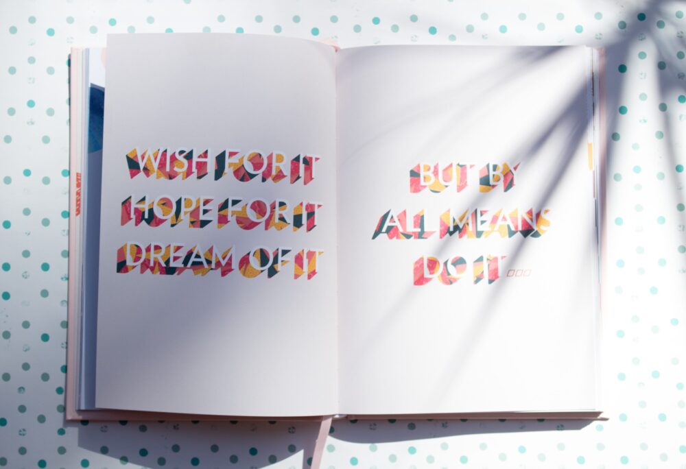 Open Book Which Says Wish For It, Hope For It, Dream Of It, But By All Means Do It.
