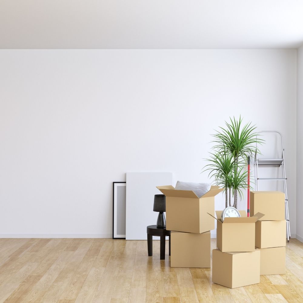 boxes packed in a room reading for moving