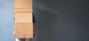 person carrying a boxes
