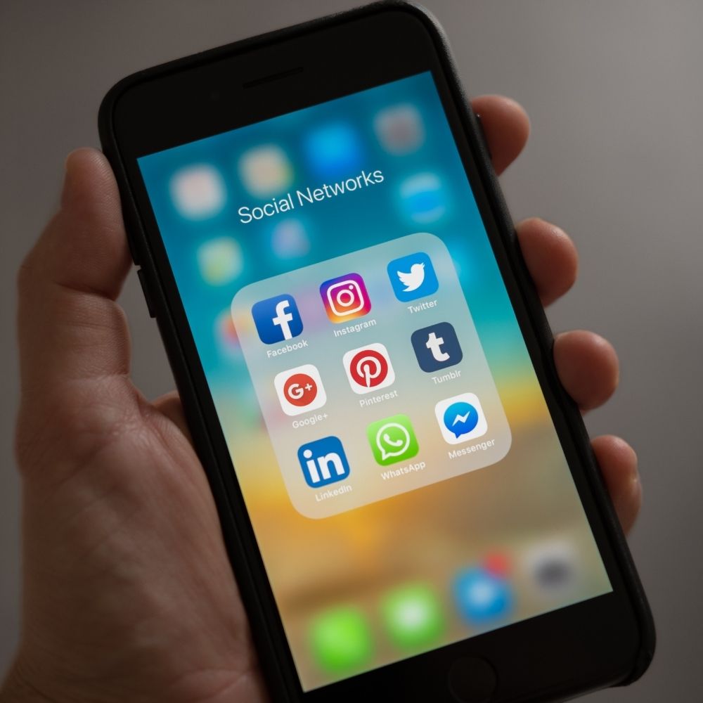 phone with social media icons on it photo